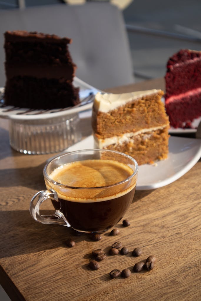 A cozy coffee setup with desserts featuring espresso and cakes in Medellín, Colombia.